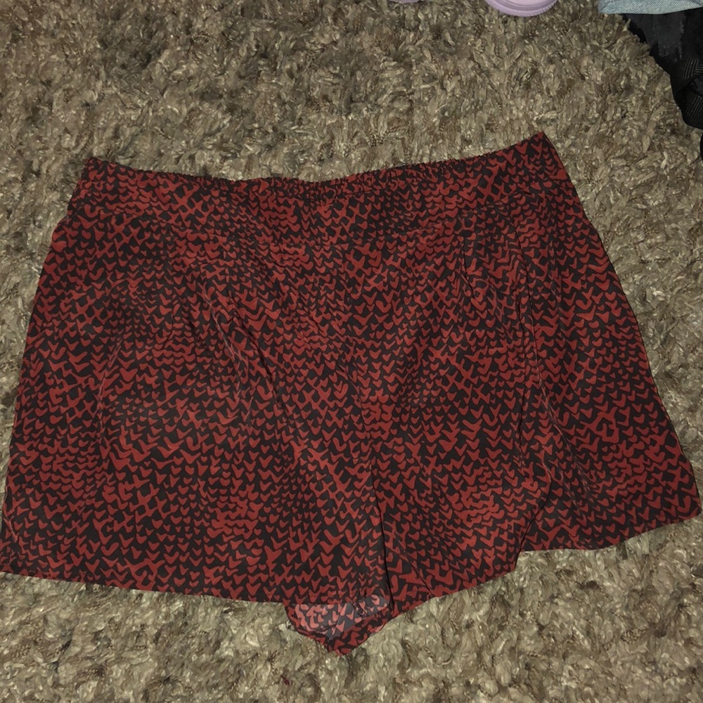 red and black pattern shorts